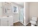 Bathroom with tiled shower and vanity sink with white cabinets at 2206 Hillcrest Ave, Albemarle, NC 28001