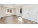Bright bedroom with two windows, wood-look floors, and a closet at 2206 Hillcrest Ave, Albemarle, NC 28001