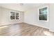 Bright bedroom with two windows and wood-look floors at 2206 Hillcrest Ave, Albemarle, NC 28001