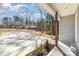Long concrete driveway leading to home, featuring a view of the wooded surroundings at 2206 Hillcrest Ave, Albemarle, NC 28001