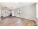 Spacious living room with wood floors, connection to kitchen and natural light at 2206 Hillcrest Ave, Albemarle, NC 28001