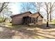 View of the rear exterior featuring a screened porch and the expansive private yard at 2652 Gabriel Ct, Fort Mill, SC 29715