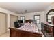 Comfortable bedroom with a wooden bed frame, dresser, and a dedicated workspace at 2652 Gabriel Ct, Fort Mill, SC 29715