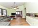 Bright living room featuring wood floors, a vaulted ceiling, and a comfortable gray sofa at 2652 Gabriel Ct, Fort Mill, SC 29715