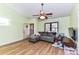 Inviting living room with wood floors, a gray sectional sofa, and lots of natural light at 2652 Gabriel Ct, Fort Mill, SC 29715
