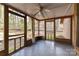 Relaxing screened porch with ceiling fan, offering an enjoyable view of the private backyard at 2652 Gabriel Ct, Fort Mill, SC 29715