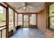 Well-lit screened porch featuring a ceiling fan, ideal for enjoying the outdoors with protection from insects at 2652 Gabriel Ct, Fort Mill, SC 29715