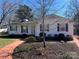 Charming one story house with a well-maintained front yard and inviting red brick walkway at 3240 Sunset Dr, Charlotte, NC 28209