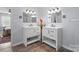 Bathroom featuring double vanities, updated fixtures, and tile flooring at 3966 Peach St # 56, Newton, NC 28658