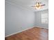 Simple bedroom with wood-look flooring and natural light, ready for personalization at 3966 Peach St # 56, Newton, NC 28658