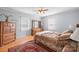 Comfortable bedroom featuring wooden furniture, hardwood floors, and plenty of natural light at 3966 Peach St # 56, Newton, NC 28658