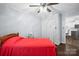 Comfortable bedroom with a ceiling fan, closet, and adjoining kitchen at 3966 Peach St # 56, Newton, NC 28658