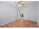 Bright bedroom with wood-look flooring and a closet, offering a neutral design at 3966 Peach St # 56, Newton, NC 28658