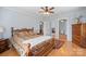 Spacious bedroom with a ceiling fan, hardwood floors, and ample closet space at 3966 Peach St # 56, Newton, NC 28658