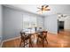 Bright dining room with wood floors, a round table, and natural light at 3966 Peach St # 56, Newton, NC 28658