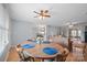 Cozy dining room featuring hardwood floors, blue accents, and a ceiling fan at 3966 Peach St # 56, Newton, NC 28658