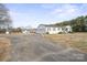 Charming home with a long driveway, large yard, and detached garage/workshop at 3966 Peach St # 56, Newton, NC 28658