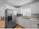 Bright kitchen with stainless steel fridge and ample cabinet space, perfect for Gathering meals at 3966 Peach St # 56, Newton, NC 28658