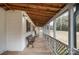 Relaxing screened porch with wood flooring and ample light at 3966 Peach St # 56, Newton, NC 28658