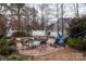 Outdoor patio with multiple seating areas, a pool, and manicured landscaping at 4006 Hickory View Dr, Fort Mill, SC 29707