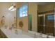 Bathroom featuring a double vanity, large mirror, and a glass-enclosed shower at 4006 Hickory View Dr, Fort Mill, SC 29707