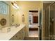 Bright bathroom with a double vanity, glass-enclosed shower and view to the main bedroom at 4006 Hickory View Dr, Fort Mill, SC 29707