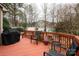 View of a spacious outdoor deck, perfect for entertaining, with chairs, grill and access to the backyard at 4006 Hickory View Dr, Fort Mill, SC 29707