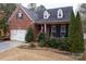 Charming brick home with a manicured front yard and cozy porch at 4006 Hickory View Dr, Fort Mill, SC 29707