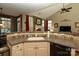 Modern kitchen with stainless steel appliances, stylish tile backsplash, and a view of the living area at 4006 Hickory View Dr, Fort Mill, SC 29707