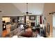 Spacious living room with fireplace, comfortable seating, and seamless flow to kitchen and dining area at 4006 Hickory View Dr, Fort Mill, SC 29707