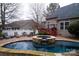 Pool and patio area with lounge chairs and a dining set at 4006 Hickory View Dr, Fort Mill, SC 29707