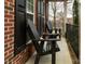 Covered porch featuring two black Adirondack chairs at 4006 Hickory View Dr, Fort Mill, SC 29707