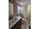 Bathroom featuring marble countertops, updated sink, and good lighting at 44 Fenix Sw Dr, Concord, NC 28025