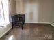 Simple room with neutral walls and carpet, featuring a dark colored crib at 44 Fenix Sw Dr, Concord, NC 28025