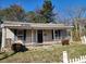 Charming single-story home with a welcoming front porch and a well-maintained yard at 44 Fenix Sw Dr, Concord, NC 28025
