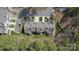 An aerial view of townhouses surrounded by green spaces, creating a peaceful residential setting at 4586 Antelope Ln, Charlotte, NC 28269