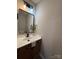 Bathroom with updated lighting fixtures and a modern vanity at 4586 Antelope Ln, Charlotte, NC 28269