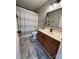 Well-lit bathroom features a modern vanity, toilet, and a stylish shower curtain, creating a comfortable space at 4586 Antelope Ln, Charlotte, NC 28269