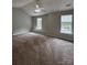 Spacious carpeted bedroom with high ceilings and natural light at 4586 Antelope Ln, Charlotte, NC 28269