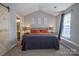 Bedroom features a vaulted ceiling, natural light, and neutral colors for a tranquil retreat at 4586 Antelope Ln, Charlotte, NC 28269