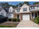 Charming townhouse featuring neutral siding, green shutters, and a one-car garage nestled in a tree-lined community at 4586 Antelope Ln, Charlotte, NC 28269