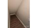 Hallway featuring warm wood-look flooring and neutral wall color at 4586 Antelope Ln, Charlotte, NC 28269