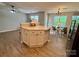 Open-concept living room features hardwood floors and a kitchen island at 4586 Antelope Ln, Charlotte, NC 28269