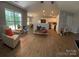 Open floor plan featuring wood flooring, great natural light, and seamless flow to kitchen at 4586 Antelope Ln, Charlotte, NC 28269