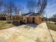 Quaint backyard with a brick home and concrete patio at 4808 Cedar Ct, Gastonia, NC 28056