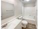 Bright bathroom with a white vanity, modern fixtures, and a shower-tub combo at 4808 Cedar Ct, Gastonia, NC 28056