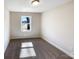 Bright bedroom featuring a neutral color palette, plush carpeting, and a window offering natural light at 4808 Cedar Ct, Gastonia, NC 28056