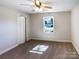 Cozy bedroom with a ceiling fan, plush carpet, and a window offering a view of the outdoors at 4808 Cedar Ct, Gastonia, NC 28056