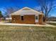 Quaint backyard with a brick home and maintained lawn at 4808 Cedar Ct, Gastonia, NC 28056