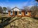 Charming single story home with brick facade, white trim, and a well-maintained lawn on a sunny day at 4808 Cedar Ct, Gastonia, NC 28056
